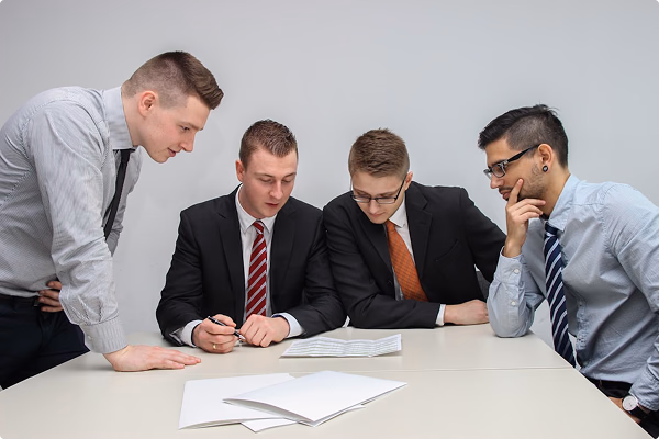Team of professionals reviewing and implementing building contracts